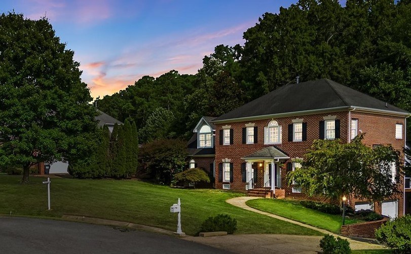 Richmond-area brick home presented in warm twilight light