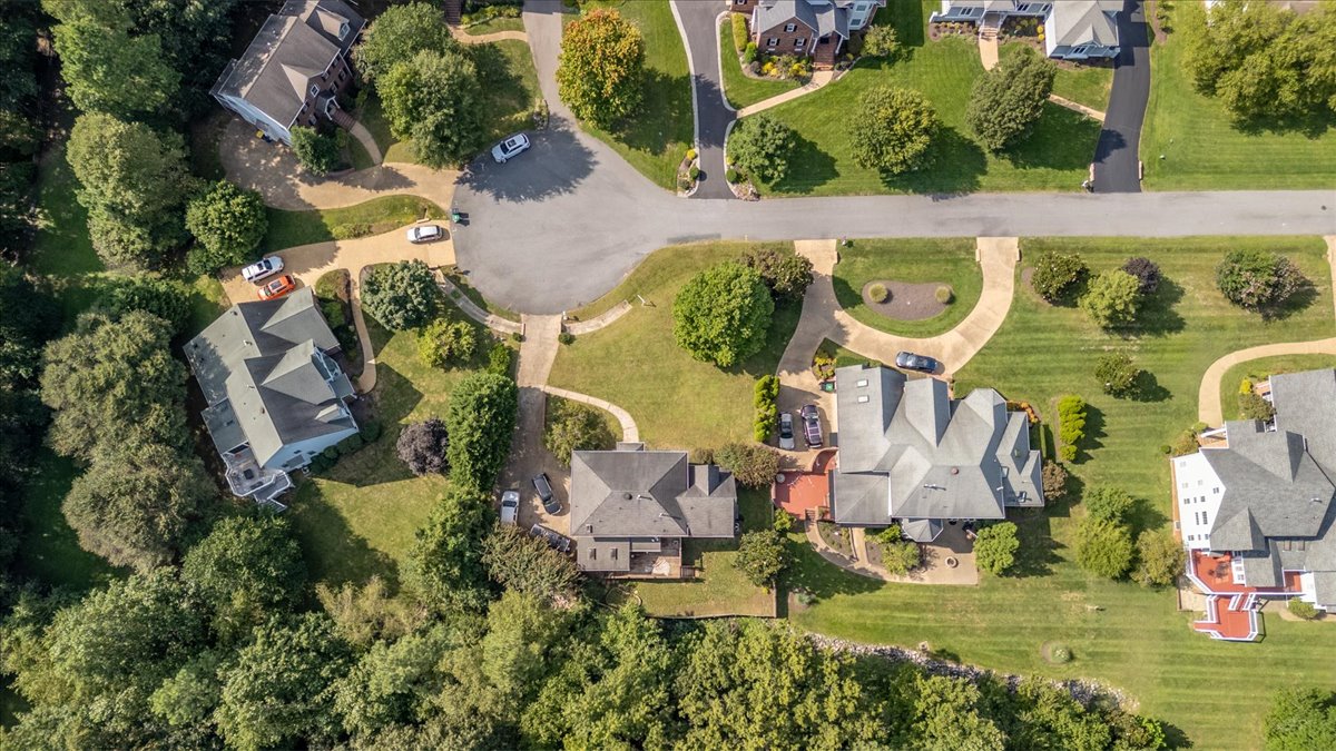 Overhead drone view of the home and surrounding lots